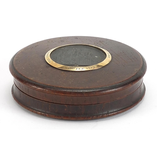 303 - George IV circular oak snuff box with inset panel of York Minster and yellow metal mount commemorati... 