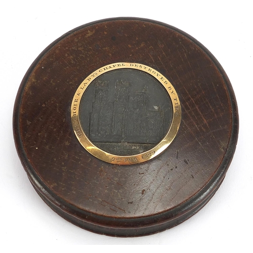 303 - George IV circular oak snuff box with inset panel of York Minster and yellow metal mount commemorati... 