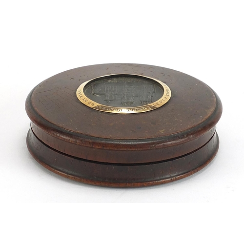 303 - George IV circular oak snuff box with inset panel of York Minster and yellow metal mount commemorati... 