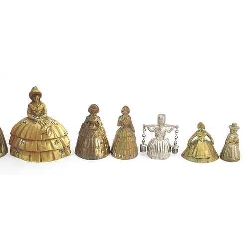 1107 - Twelve brass and white metal Crinoline Lady table bells, the largest 10.2cm high