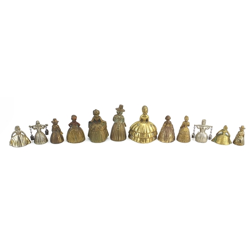 1107 - Twelve brass and white metal Crinoline Lady table bells, the largest 10.2cm high