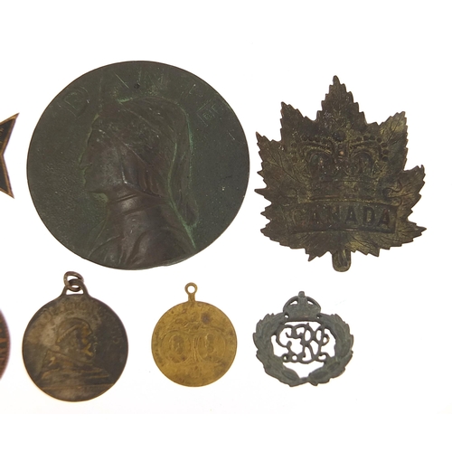 648 - Badges and medallions, some military interest including circular bronze example of Dante, the larges... 