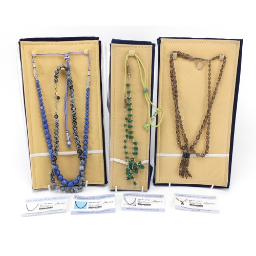 2173 - Four semi precious stone necklaces with silver clasps and certificates comprising smoky quartz, Mada... 