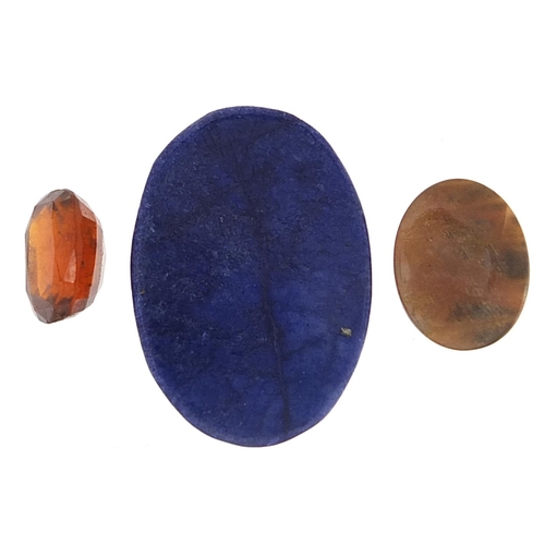 1959 - Three gemstones with certificates comprising hessonite garnet 10.05 carat, oval cabochon sunstone 12... 