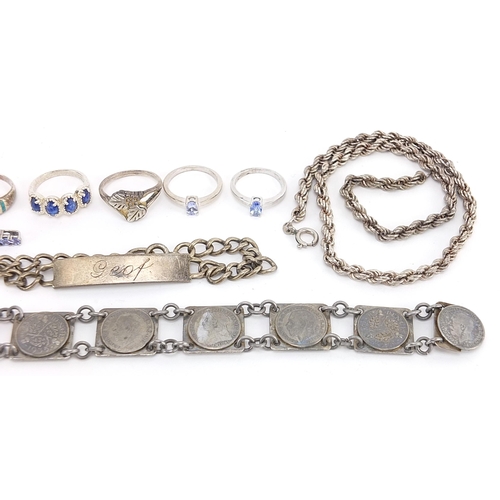 1909 - Silver jewellery including a thrupenny bit bracelet, necklaces, rings and identity bracelet, 95.6g