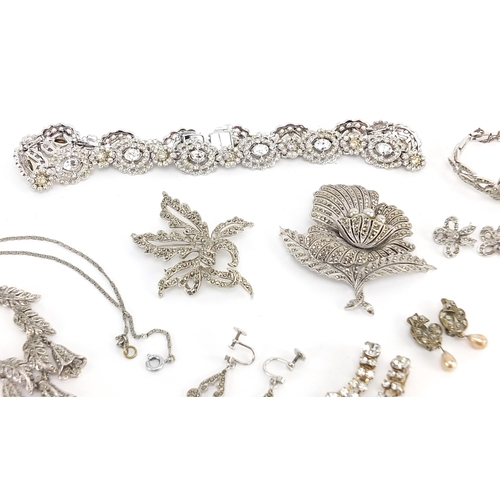 2138 - Collection of white metal marcasite and clear stone jewellery including wristwatch, brooches, neckla... 