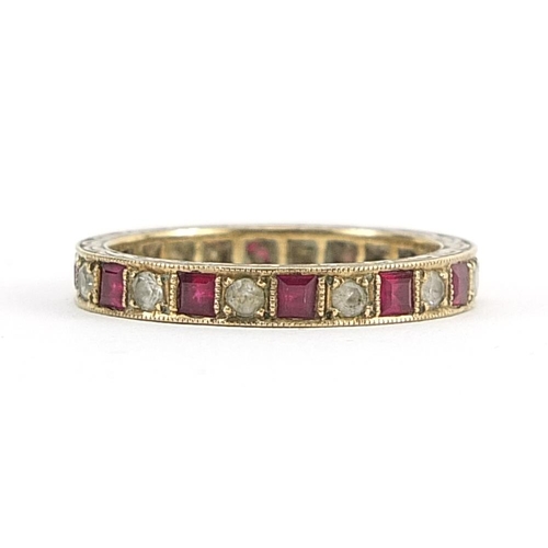 1941 - 9ct gold ruby and white sapphire eternity ring, size P, 2.7g