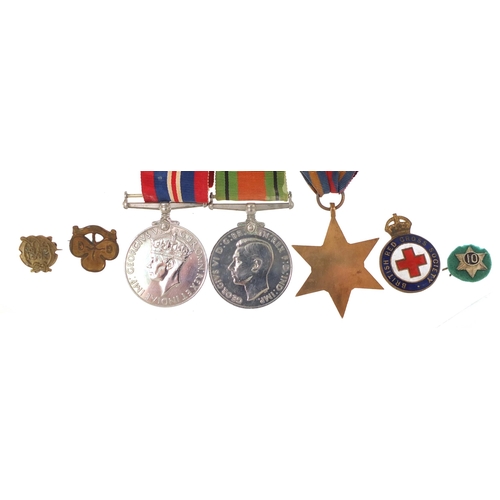 2297 - British military World War II three medal group and four badges including British Red Cross Society