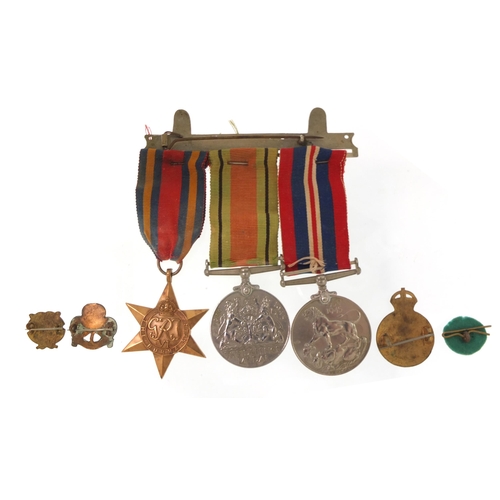 2297 - British military World War II three medal group and four badges including British Red Cross Society