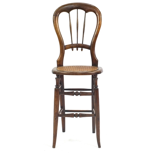 801 - 19th century hardwood child's correction chair, 95cm high