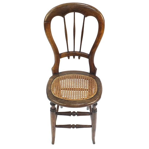 801 - 19th century hardwood child's correction chair, 95cm high