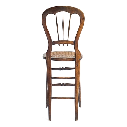 801 - 19th century hardwood child's correction chair, 95cm high