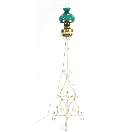 869 - Vintage wrought iron floor standing adjustable oil lamp converted to electric use, overall 172cm hig... 