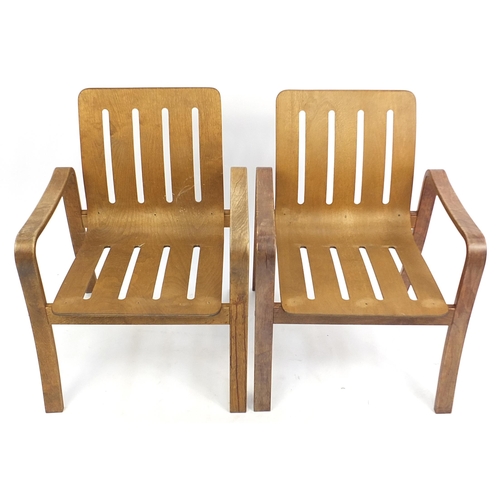 827 - Pair of mid century bent plywood armchairs, 74cm high