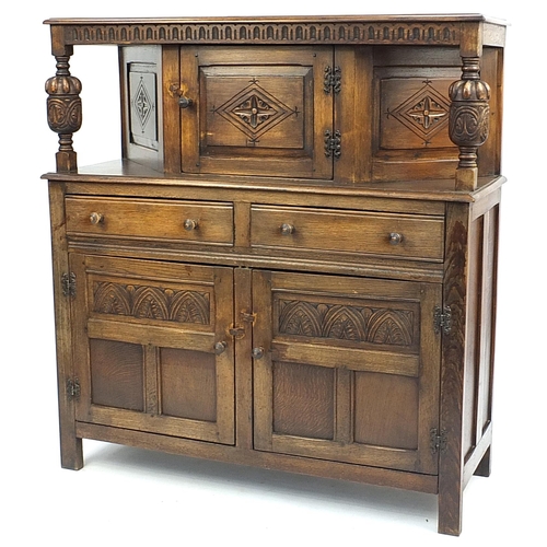 872 - Ipswich oak court cupboard with a central door above two frieze drawers and pair of cupboard doors, ... 