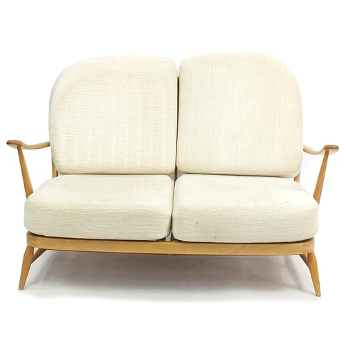 819 - Ercol light elm Windsor two seater settee, 134cm wide