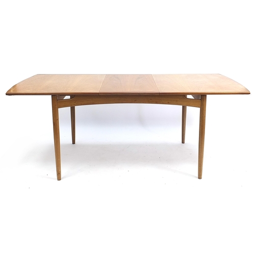 798 - G Plan E-Gomme, mid century teak extending dining table with four chairs, the table 73.5cm H x 147cm... 