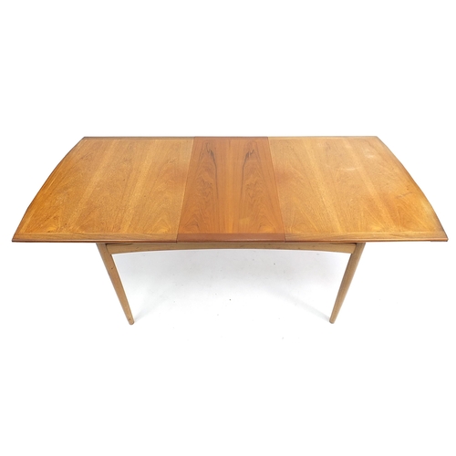 798 - G Plan E-Gomme, mid century teak extending dining table with four chairs, the table 73.5cm H x 147cm... 