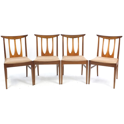 798 - G Plan E-Gomme, mid century teak extending dining table with four chairs, the table 73.5cm H x 147cm... 