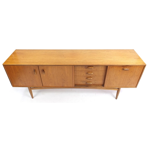 799 - Mid century teak sideboard with pair of cupboard doors, four drawers and drop down door, 79cm H x 20... 