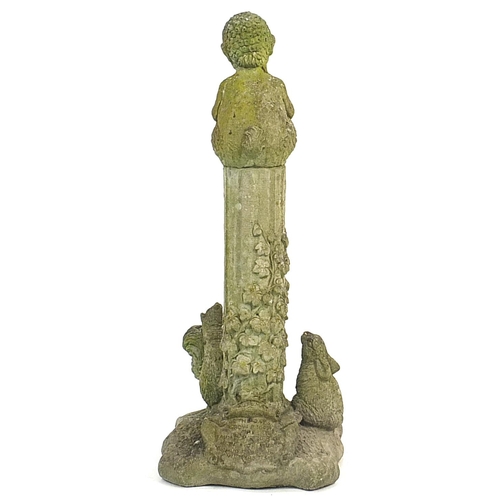 891 - Garden stoneware figure of a faun sitting on a column, 84cm high