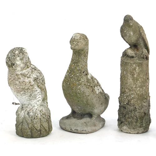 892 - Four garden stoneware birds including woodpecker and owl, the largest 47cm high