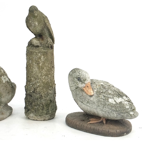 892 - Four garden stoneware birds including woodpecker and owl, the largest 47cm high