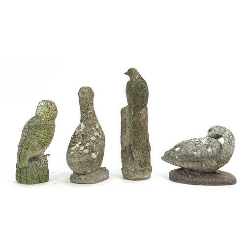 892 - Four garden stoneware birds including woodpecker and owl, the largest 47cm high