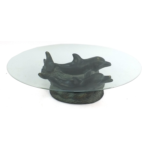 833 - Contemporary dolphin coffee table with oval glass top, 38cm H x 122cm W x 61cm D