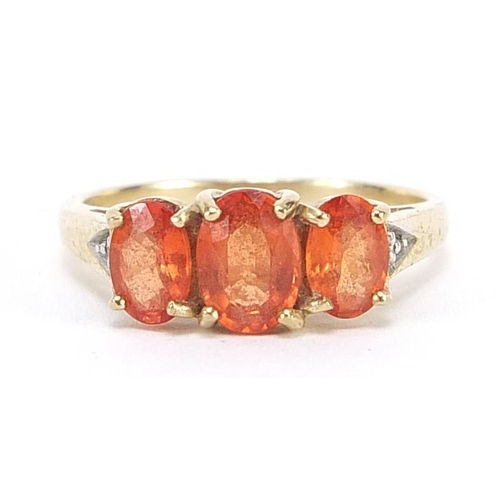 2007 - 9ct gold orange stone ring with diamond set shoulders, size N, 2.5g