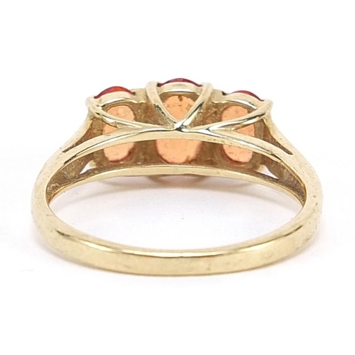 2007 - 9ct gold orange stone ring with diamond set shoulders, size N, 2.5g