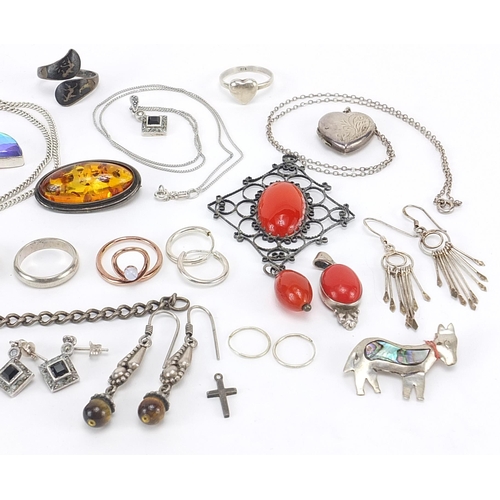 2142 - Silver and white metal jewellery including amber brooch, enamelled Canadian leaf brooch, bracelets, ... 