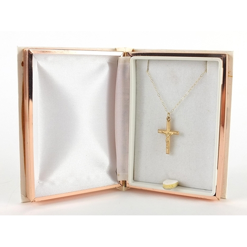 1980 - 9ct gold crucifix pendant on a 9ct gold necklace housed in a bible design box, 2.5cm high and 40cm i... 