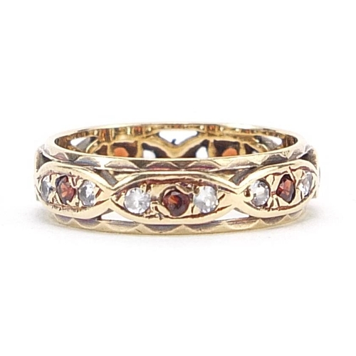 1770 - 9ct gold red and clear stone eternity ring, size I/J, 2.3g