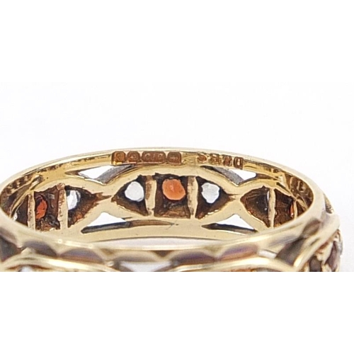 1770 - 9ct gold red and clear stone eternity ring, size I/J, 2.3g