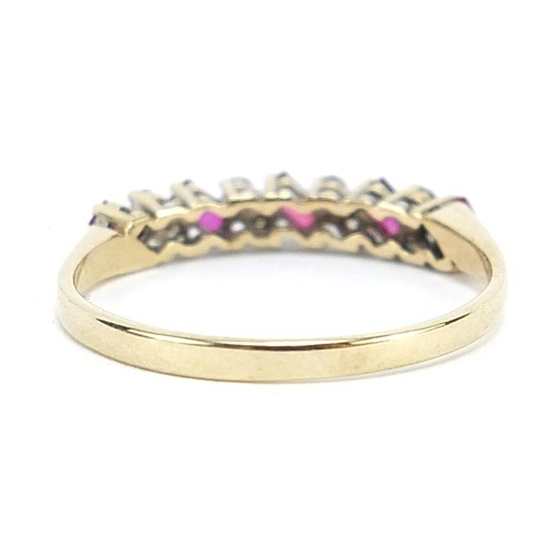 1762 - 9ct gold ruby and diamond half eternity ring, size R, 1.6g