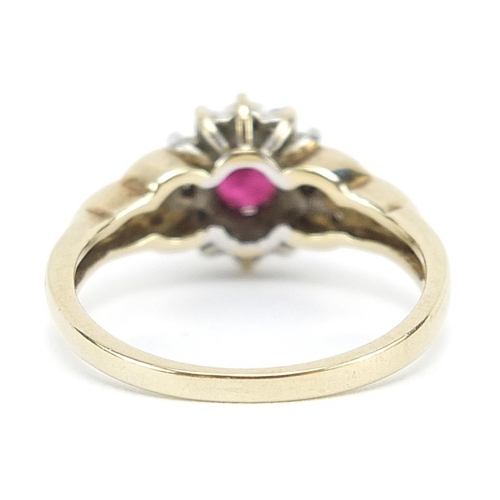 1897 - 9ct gold diamond and ruby cluster ring with diamond set shoulders, size N/O, 3.0g