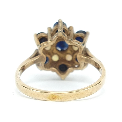 1864 - 9ct gold sapphire and opal flower head ring, size K/L, 2.5g