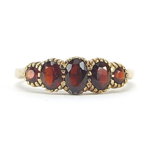 1913 - 9ct gold garnet five stone ring, size S, 2.9g