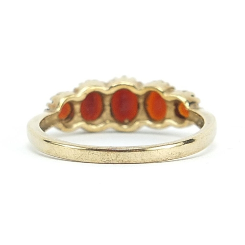 1913 - 9ct gold garnet five stone ring, size S, 2.9g