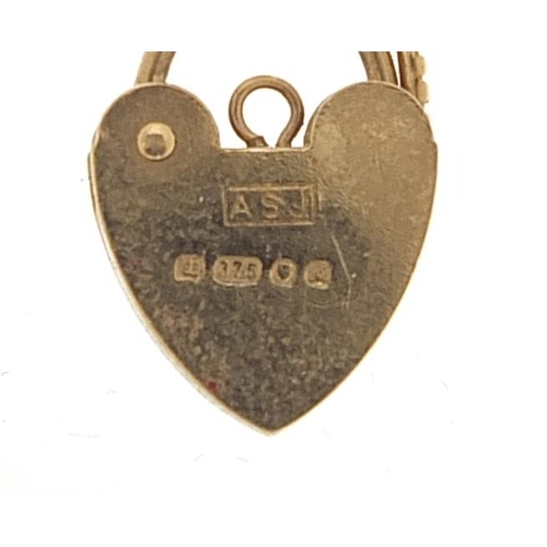 2040 - 9ct gold love heart padlock, 1.5cm in length, 1.0g