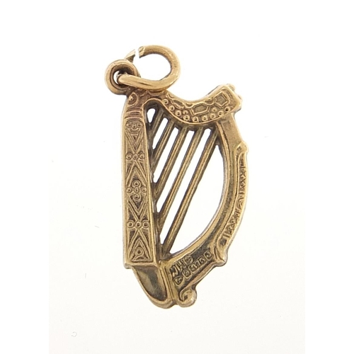 1923 - 9ct gold harp charm, 1.8cm high, 0.6g