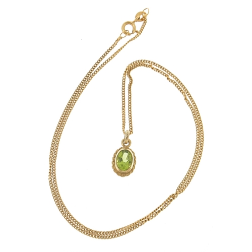 1963 - 9ct gold peridot pendant on a 9ct gold necklace, 1.5cm high and 41cm in length, 2.7g