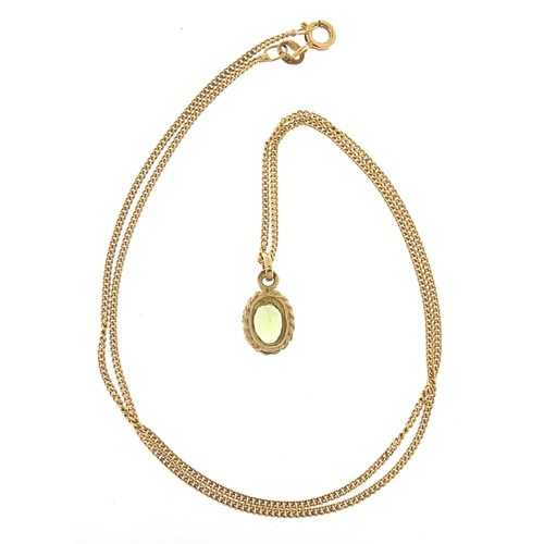 1963 - 9ct gold peridot pendant on a 9ct gold necklace, 1.5cm high and 41cm in length, 2.7g