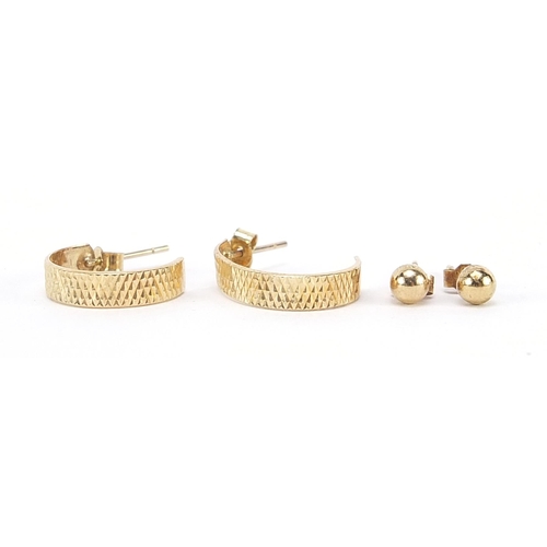 2000 - Two pairs of 9ct gold earrings comprising ball studs and hoops, the largest 1.6cm high, 1.1g