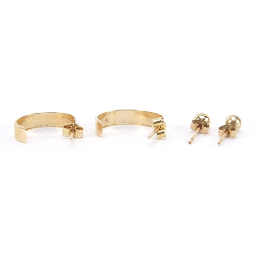 2000 - Two pairs of 9ct gold earrings comprising ball studs and hoops, the largest 1.6cm high, 1.1g