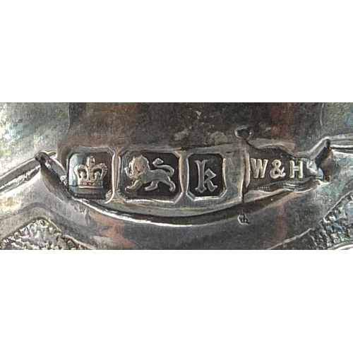 2229 - Walker & Hall, Edwardian silver christening tankard profusely embossed with flowers and foliage, She... 