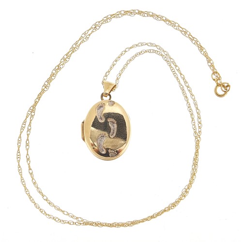 2016 - 9ct gold oval footprint locket on a 9ct gold necklace, 2.3cm high and 44cm in length, 1.8g