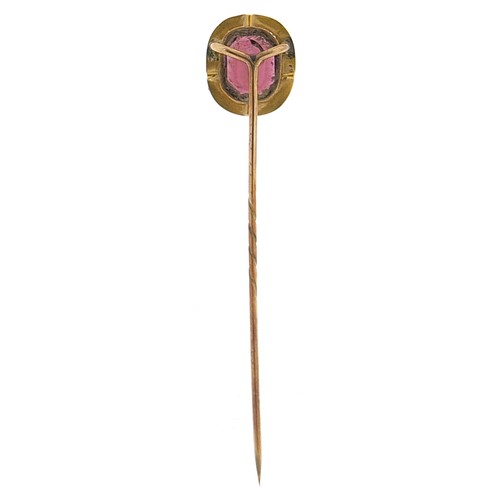 1796 - Antique unmarked gold purple stone stickpin, possibly garnet, housed in a velvet and silk lined leat... 