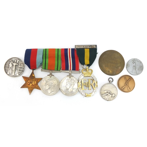 2299 - British military World War II four medal group relating to Captain R G Garrett including Elizabeth I... 